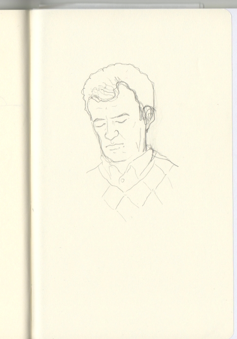 Dibujo de un hombre que viste jersey de rombos, la mirada baja, apuntando a su lectura.