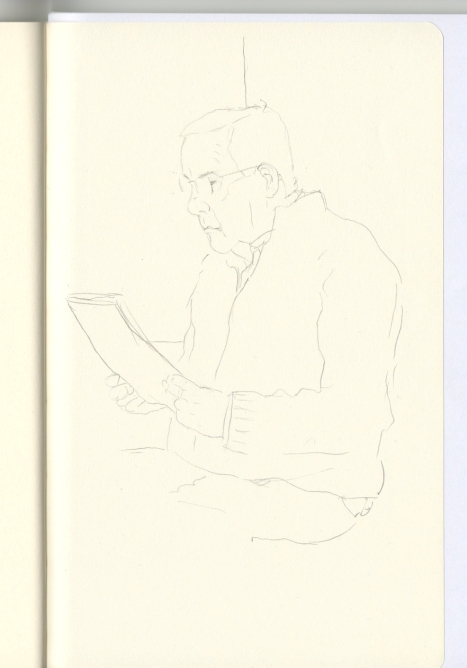 Dibujo de un hombre que lee un peri�dico gratuito en el tren.